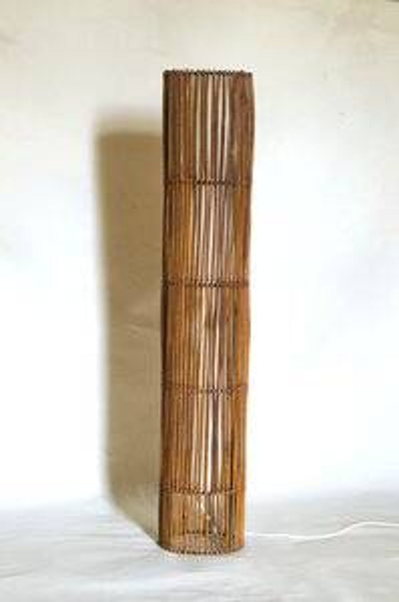 Mid-century rattan floor lamp, in the style of Louis Sognot.