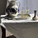 Very large vintage ceramic carafe in white glazed with blue floral decoration.