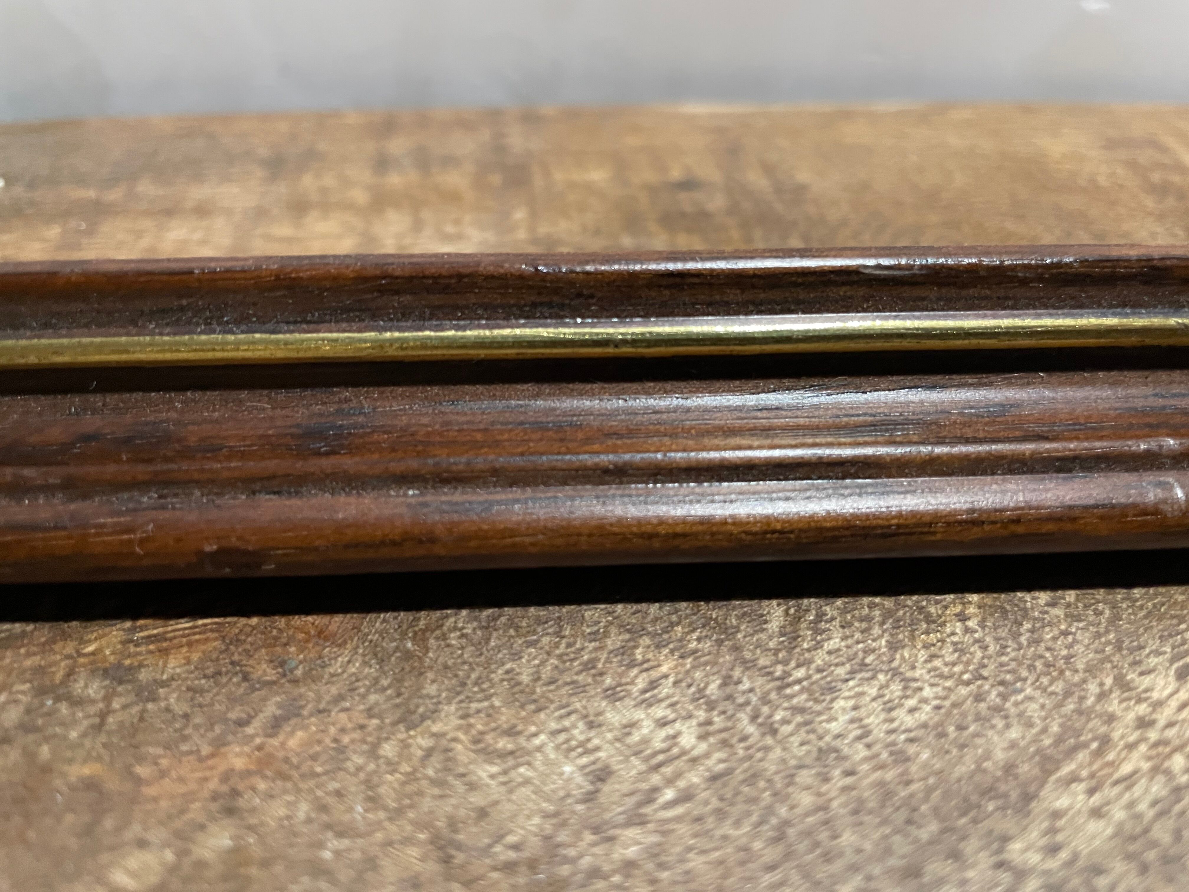 Large wooden frame with gilded outline