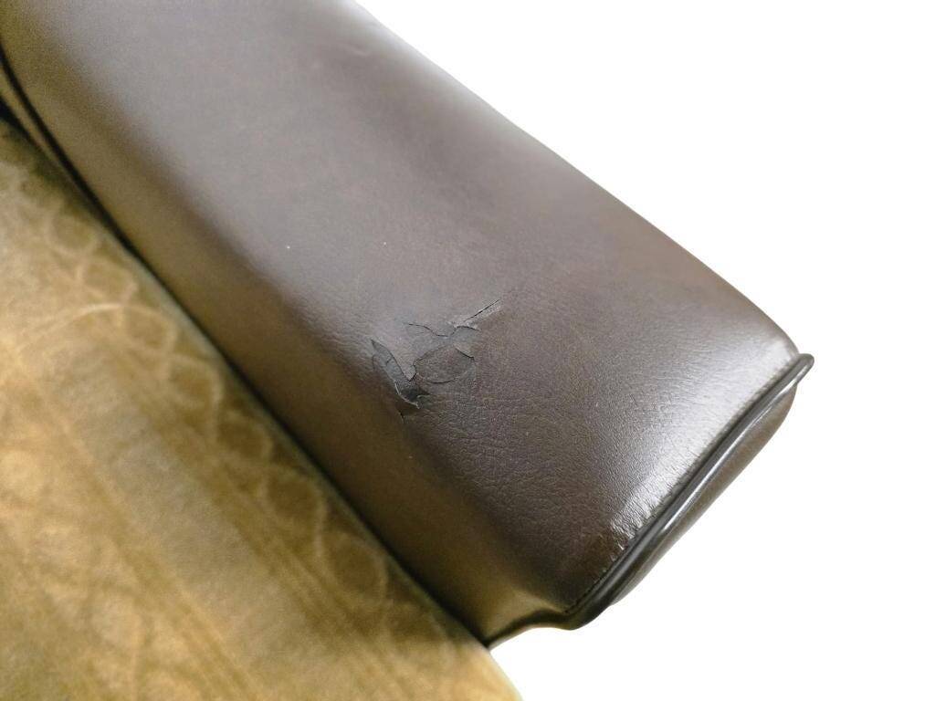 Vintage brown faux leather armchair / retro club chair on wheels