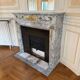 Louis XVI fireplace in veined grey marble with original gilded bronzes from the 19th century.