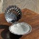 Vintage silver-plated shell butter dish with transparent bowl.