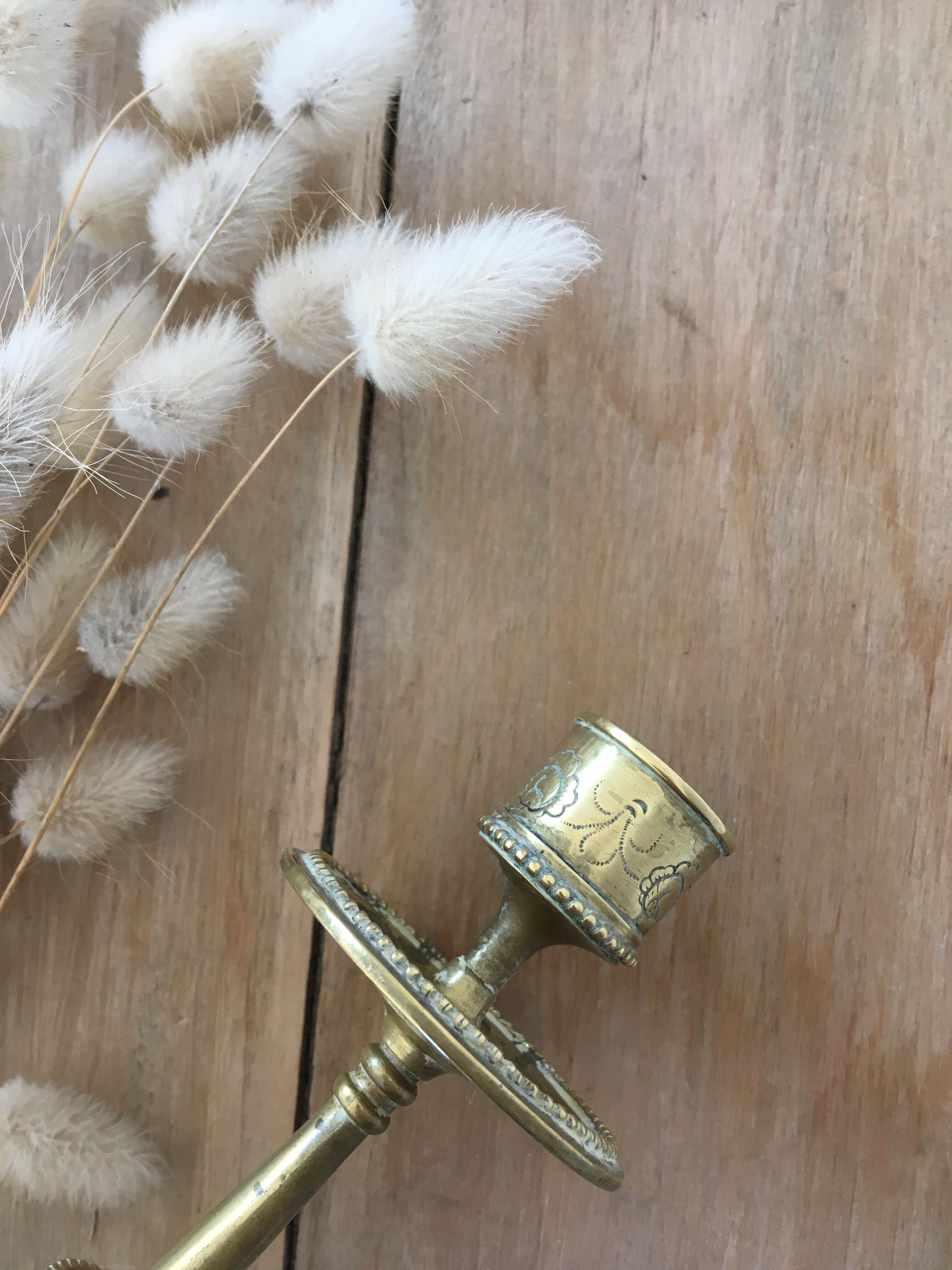 Chiseled brass candle holder