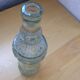 Bouteille en verre moulé
