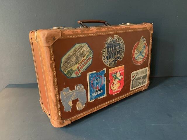 Old travel suitcase and legendary stickers, 1920
