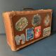 Old travel suitcase and legendary stickers, 1920