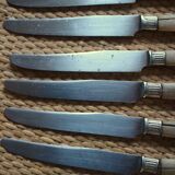 Lot of 8 antique knives with wooden handles.