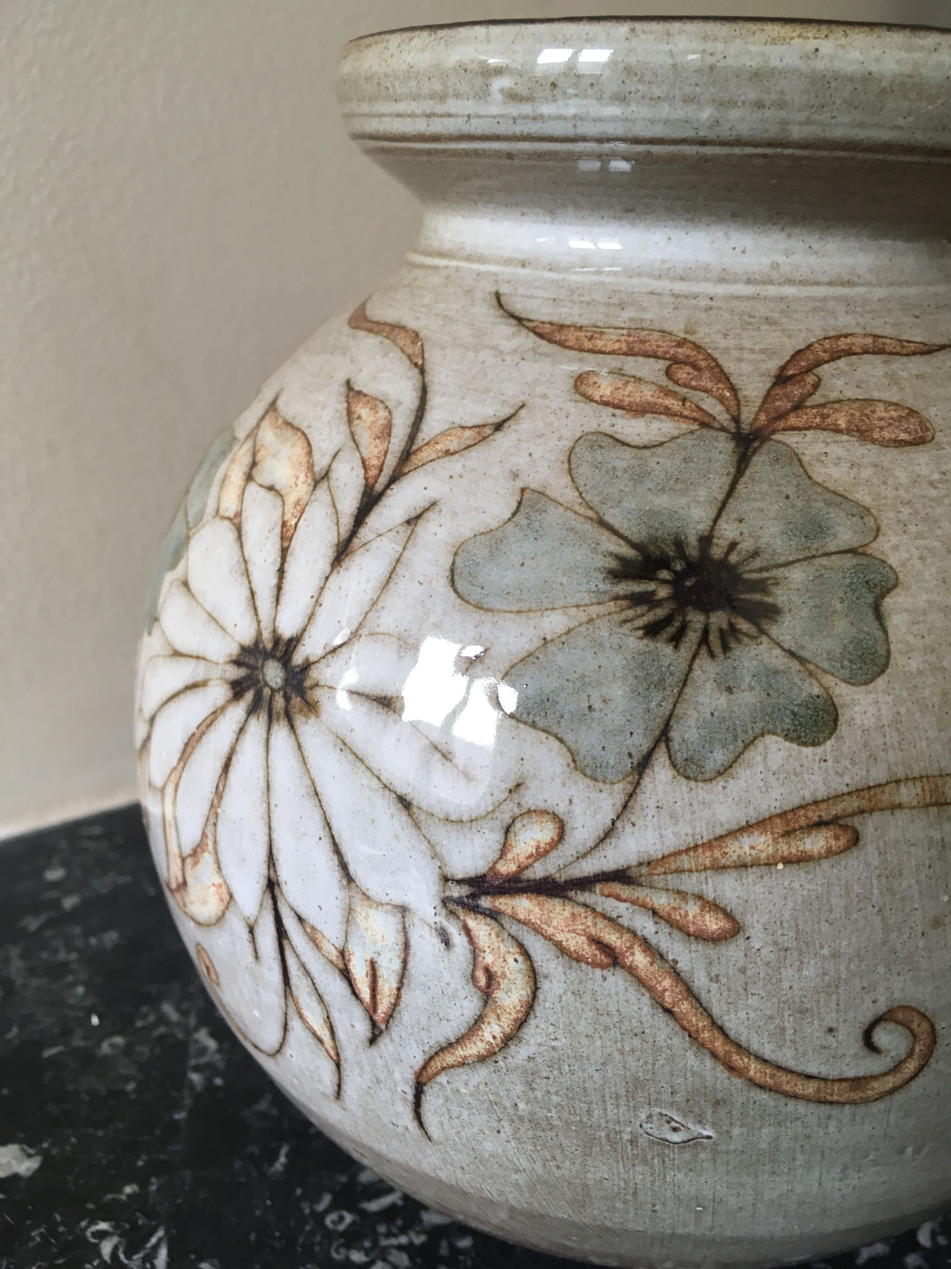 Glazed stoneware ball vase decorated with flowers