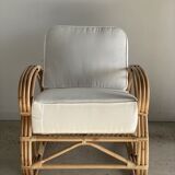 Large rattan rest chair and white cushions