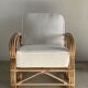 Large rattan rest chair and white cushions