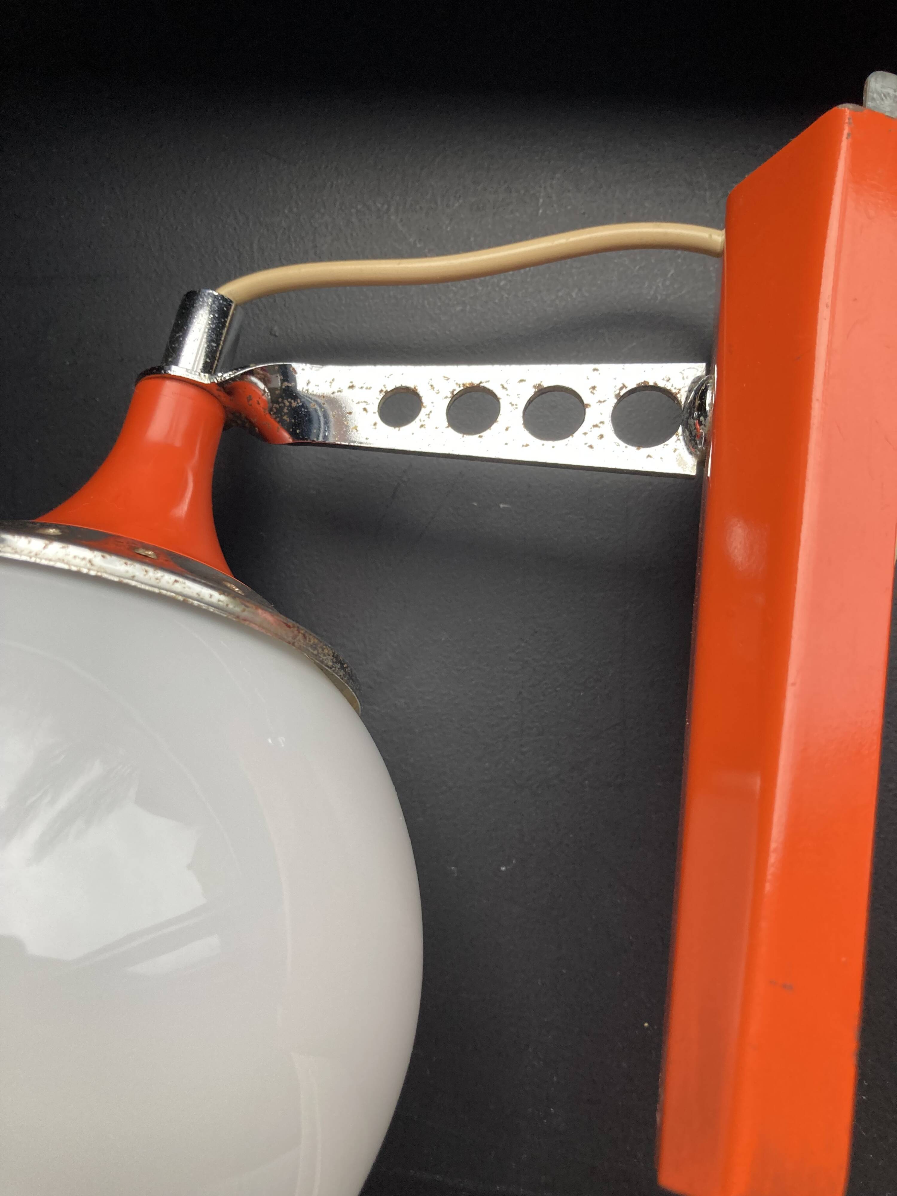 Set of two vintage orange wall lights from the 70s