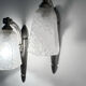 Silver Art Deco wall lights with frosted glass.