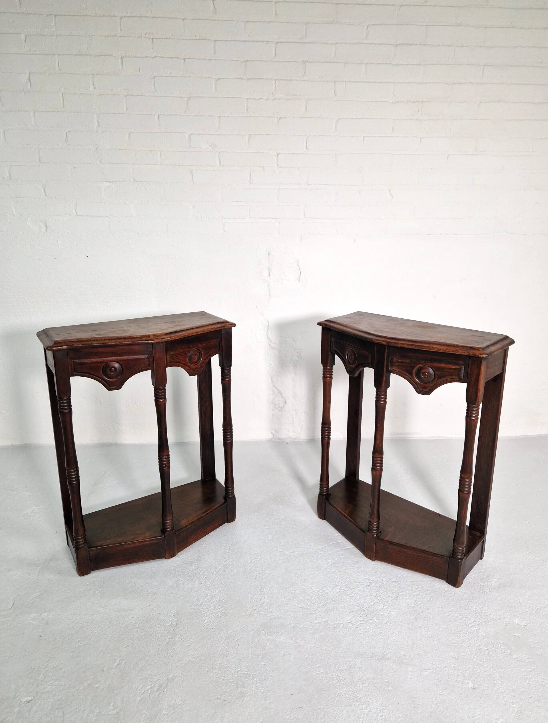 Pair of English 1920s carved oak sidetables