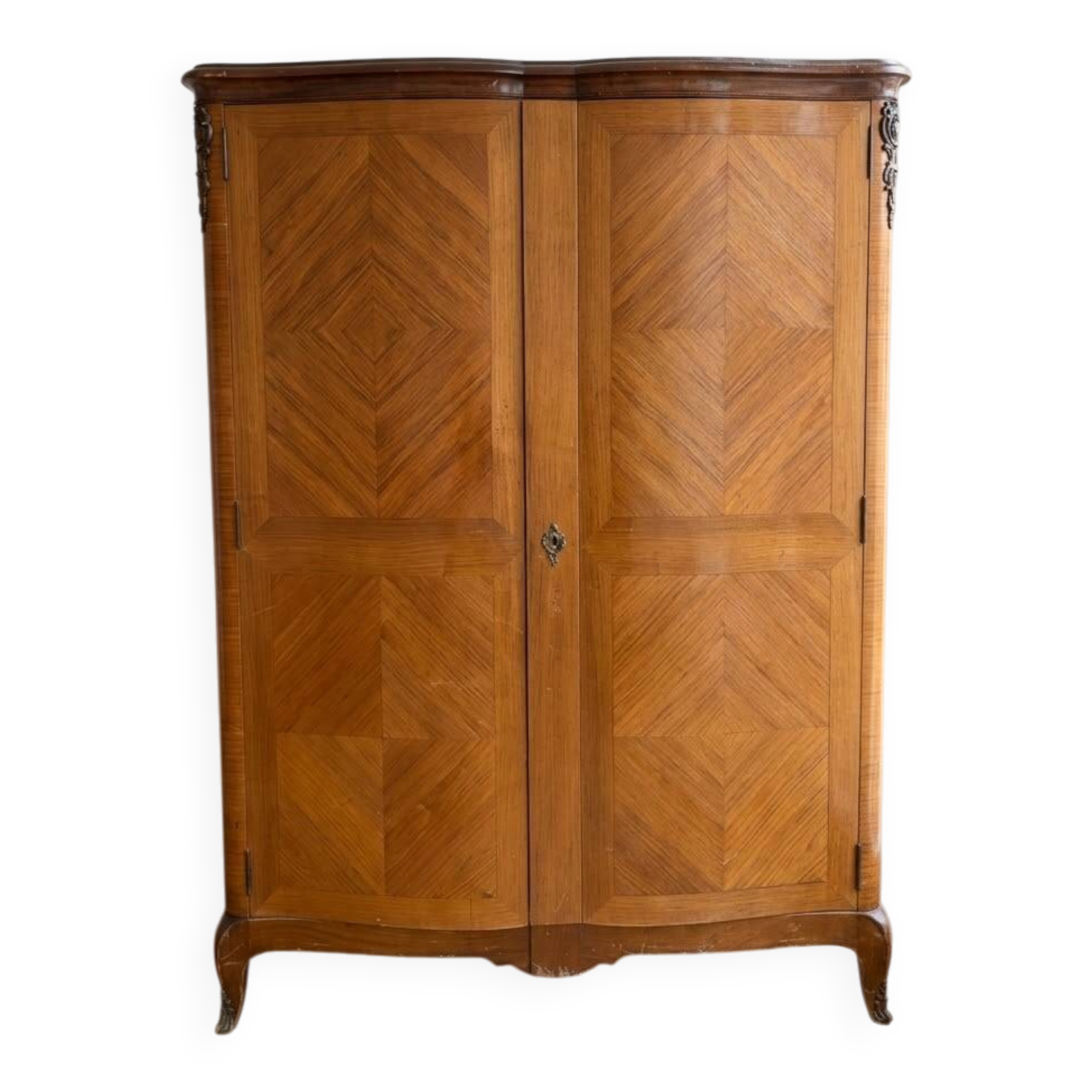 Antique Louis XV wardrobe in wood with chevron pattern.