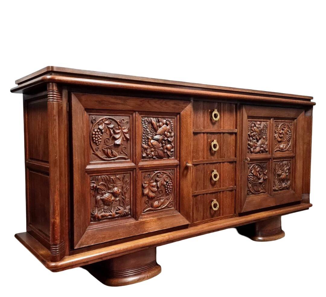 According to Charles Dudouyt: sideboard in a row in solid oak.