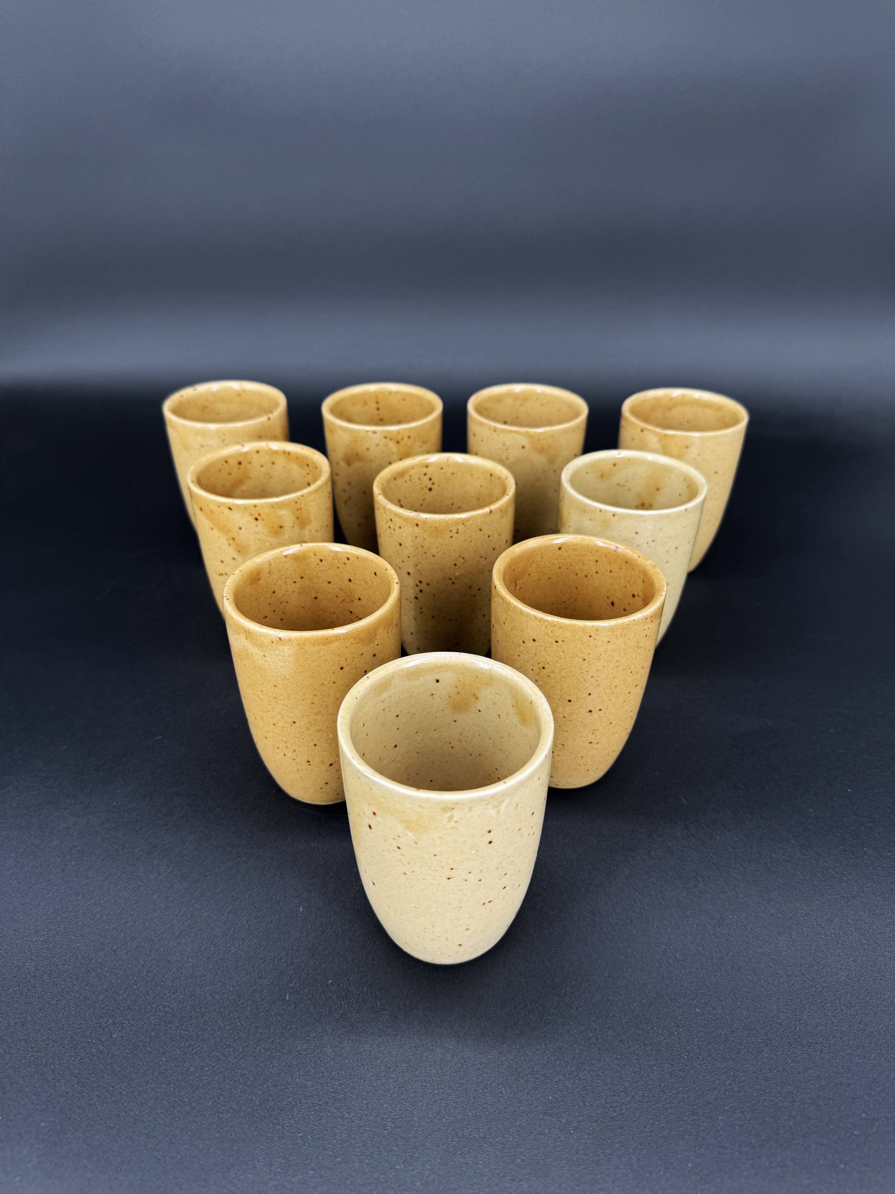 10 glazed stoneware cups signed Digoin