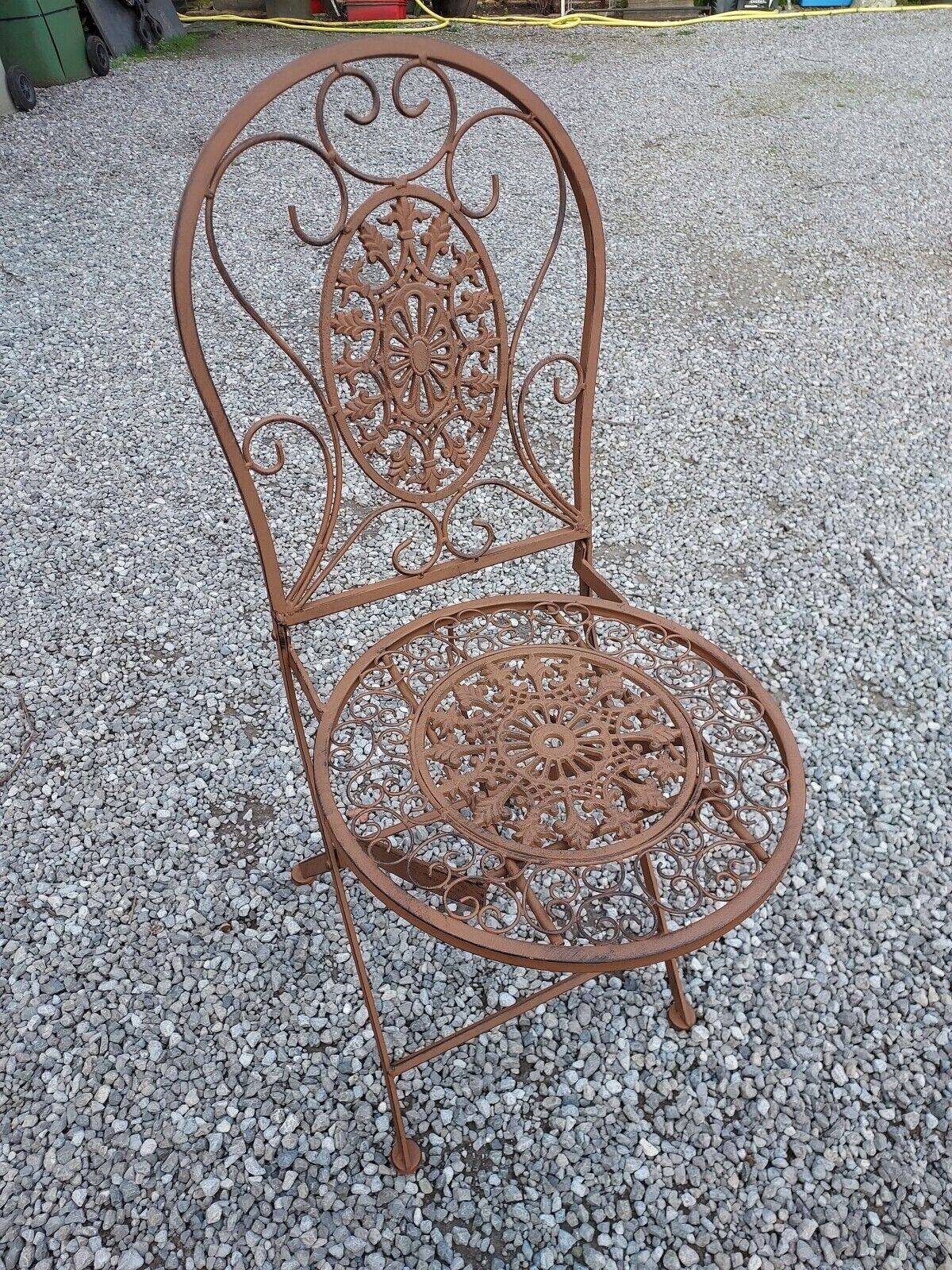 Garden furniture in brown patinated iron