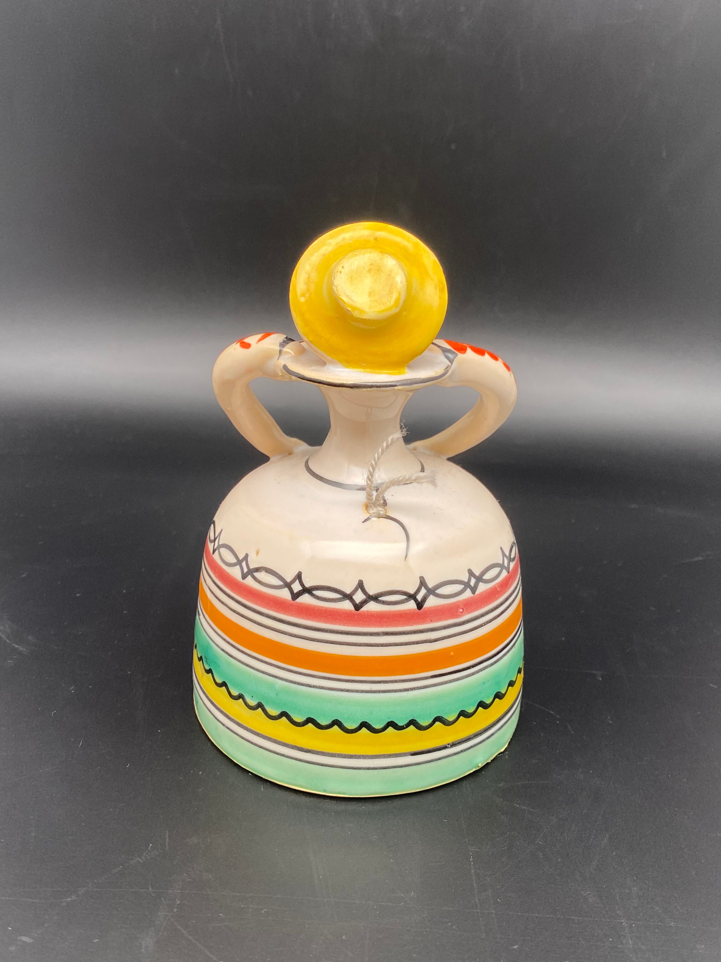 Trio of ceramic bell figurines