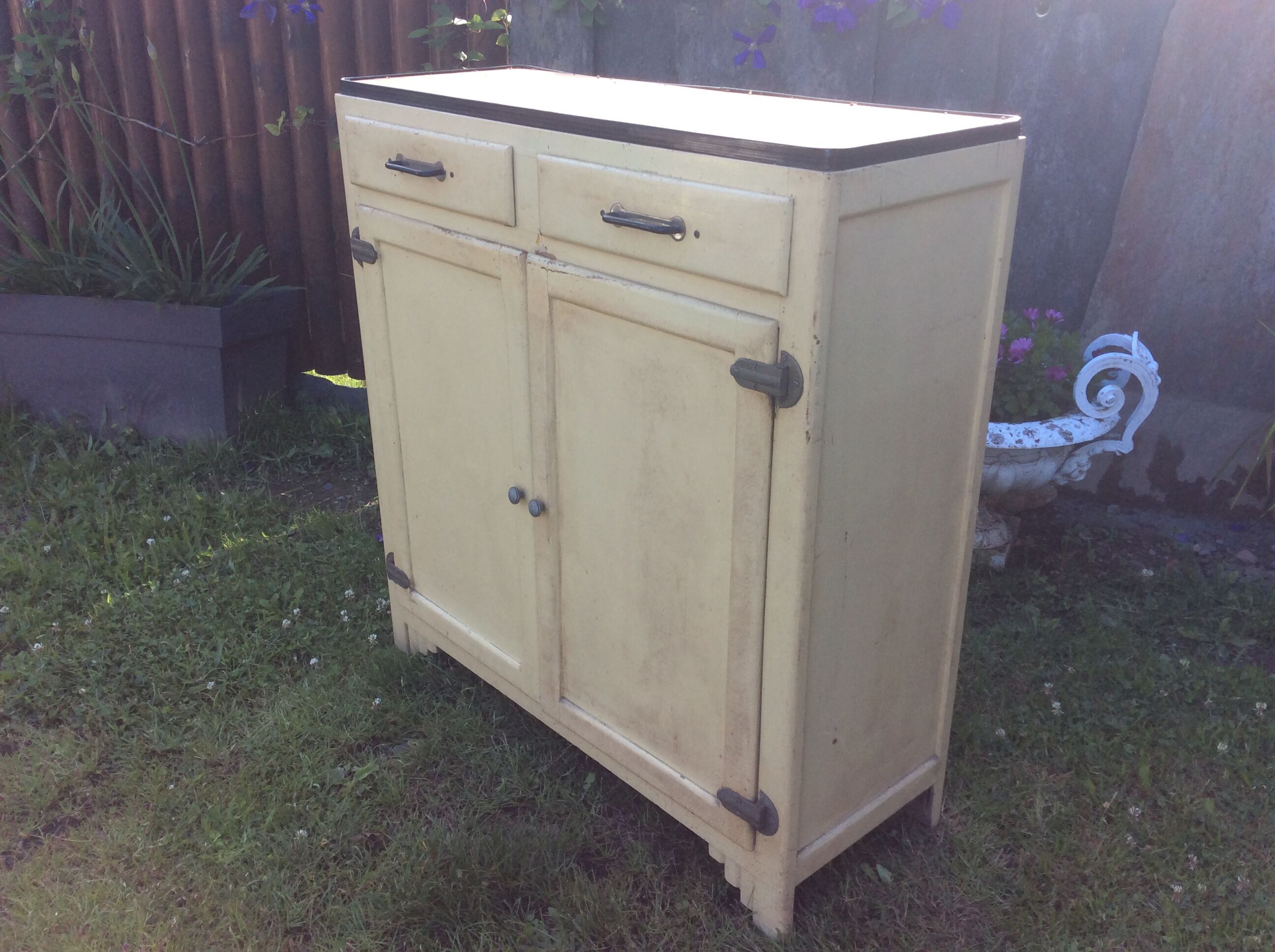 Parisian buffet painted in yellow with 2 doors and 2 drawers from an old Trailer.
