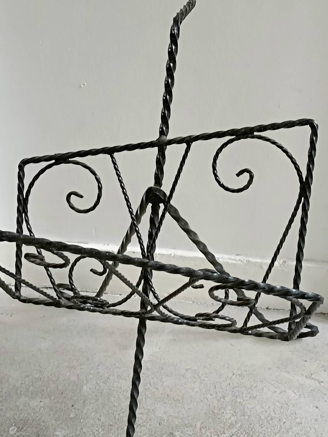 Vintage wrought iron magazine rack