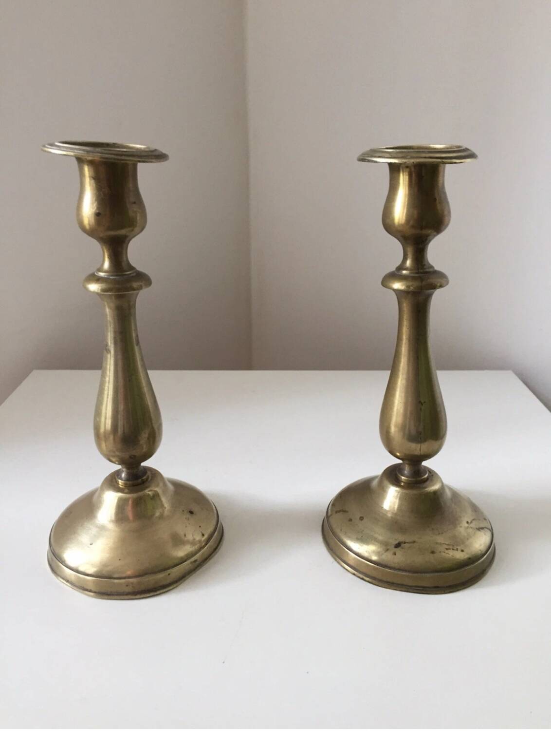 Pair of antique gilt brass candlesticks