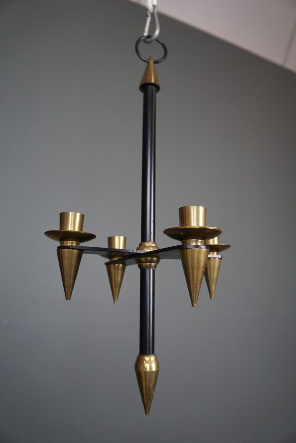 Candle holder in black metal and brass