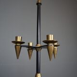 Candle holder in black metal and brass