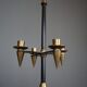 Candle holder in black metal and brass