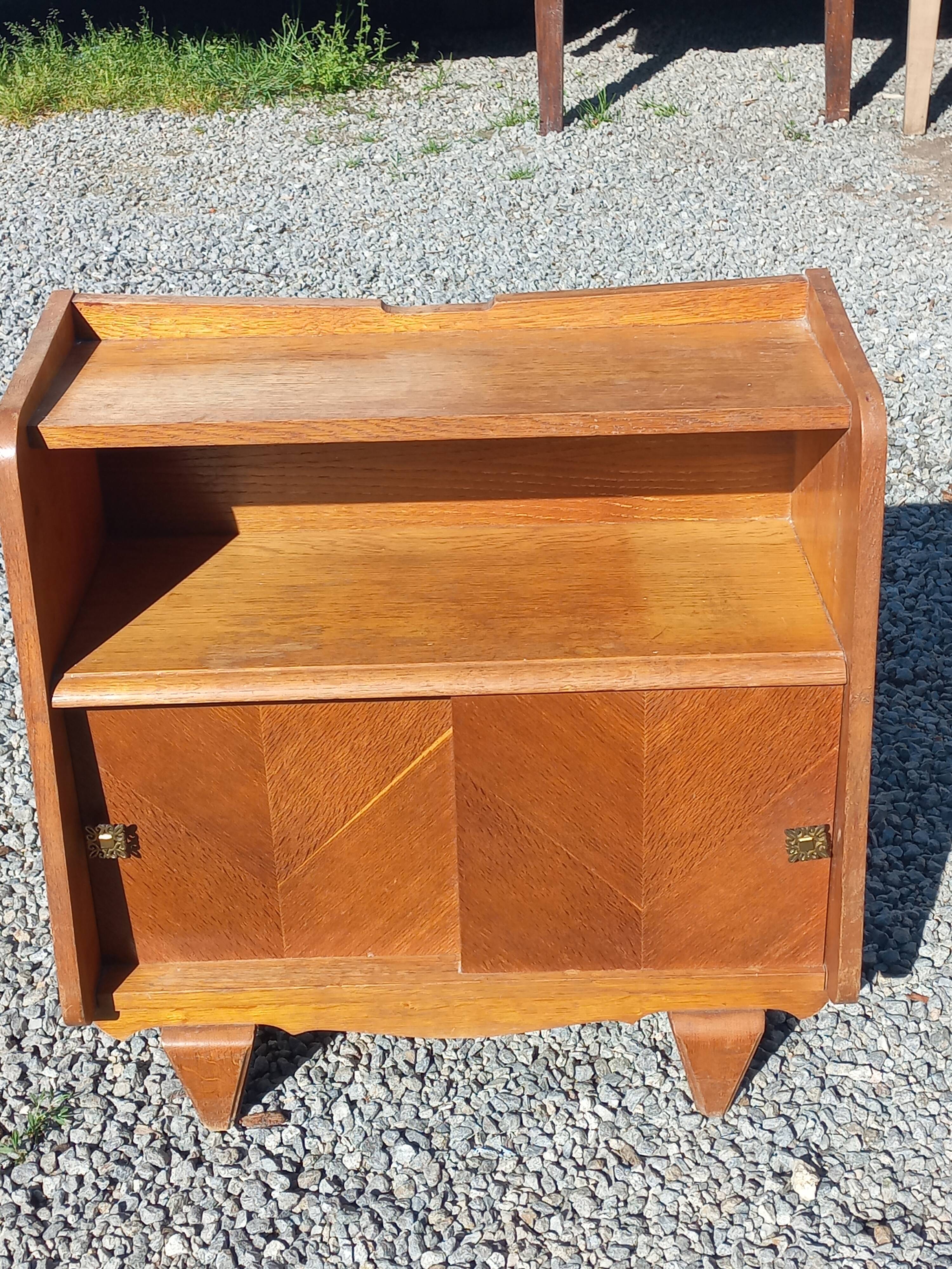 Vintage accent furniture in golden blonde oak with 2 sliding doors.