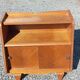 Vintage accent furniture in golden blonde oak with 2 sliding doors.