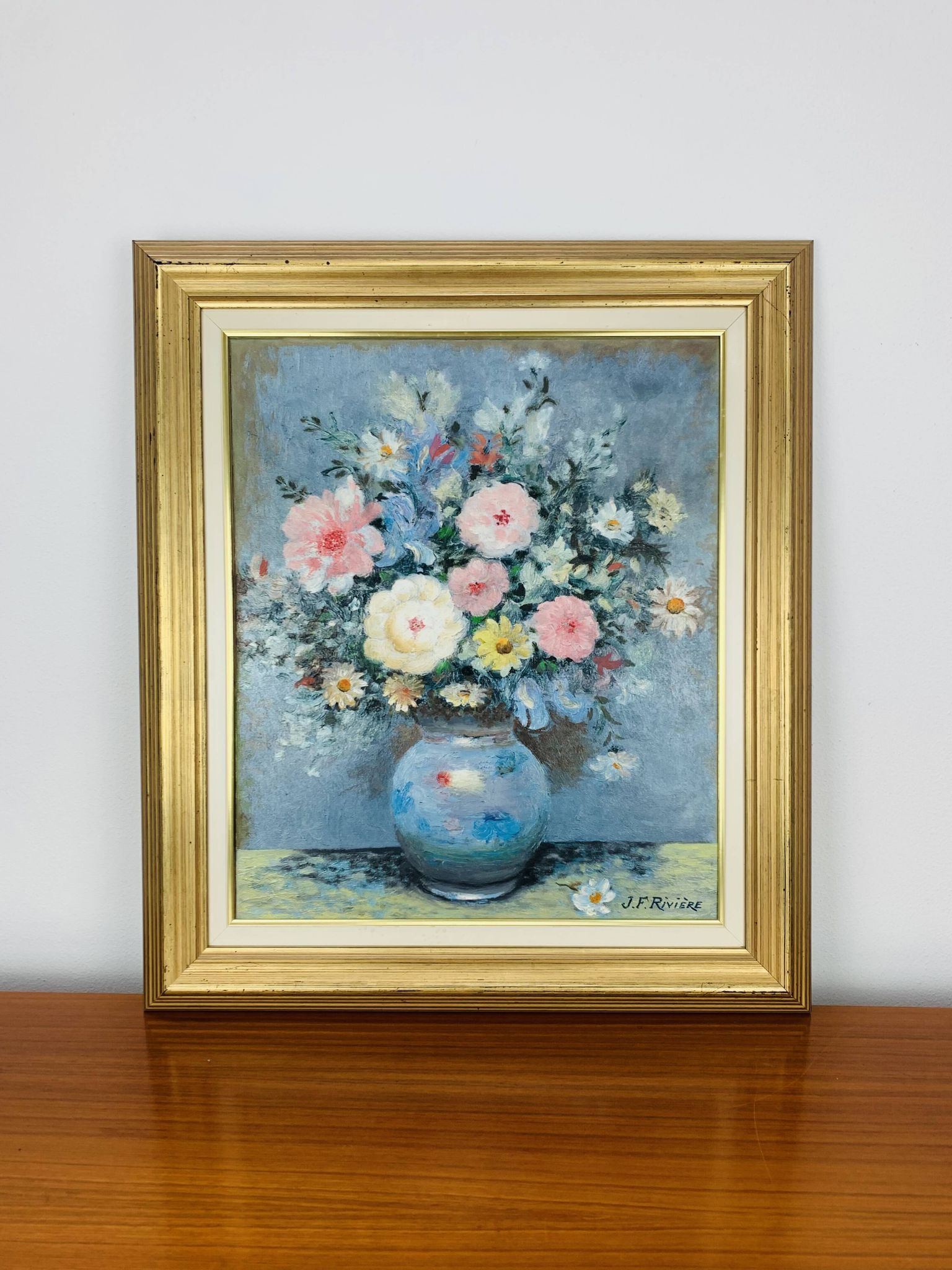 Still life painting of a bouquet of flowers, golden frame