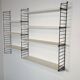 Vintage Nisse Strinning wall rack with 7 white shelves