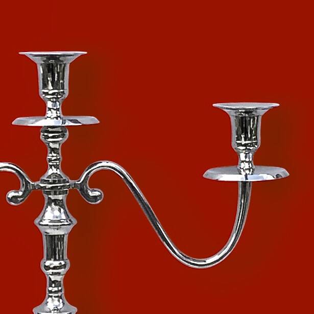 Pair of vintage three-armed chrome metal candlesticks