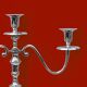 Pair of vintage three-armed chrome metal candlesticks