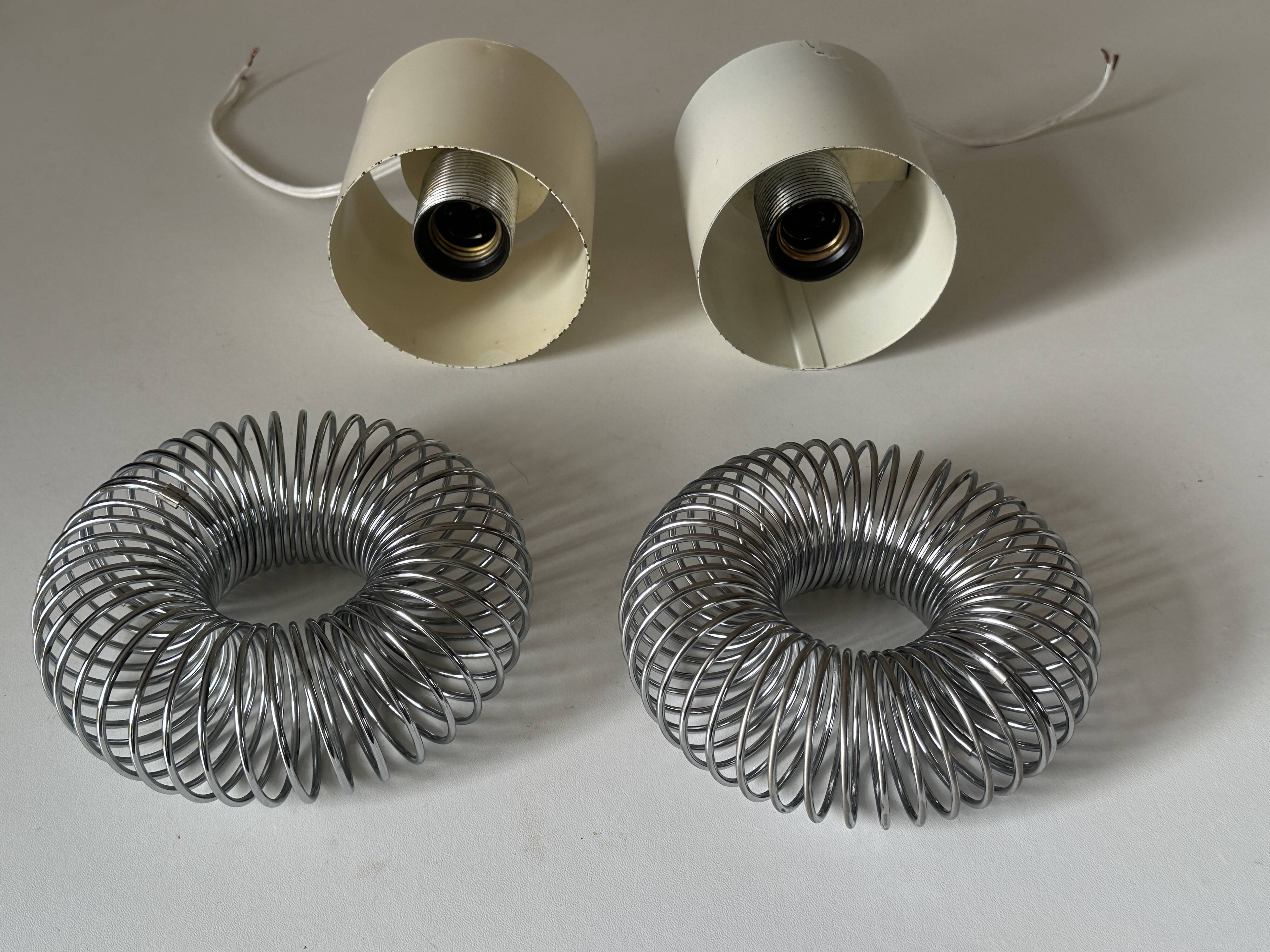 Pair of vintage design spring lamp wall lights from the 70s