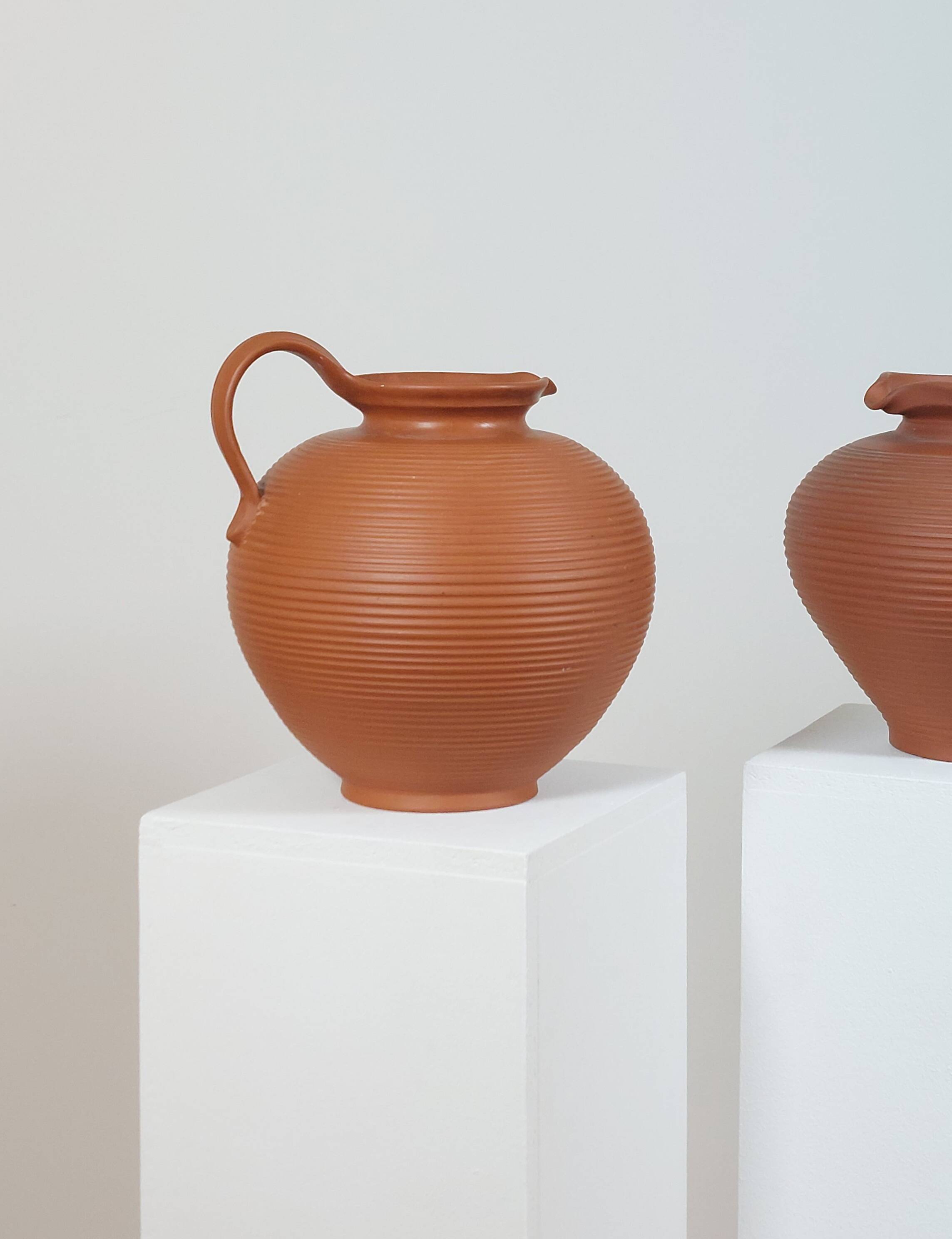 Pair of handcrafted terracotta vases from the mid-century.