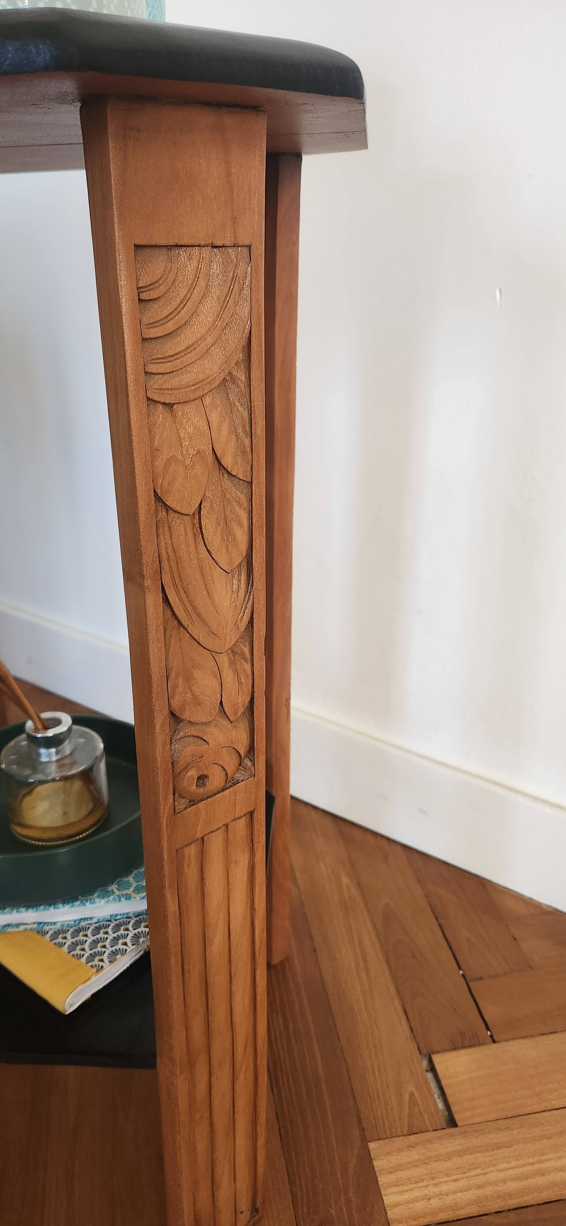 Art Deco console with sculpted black lacquered legs.