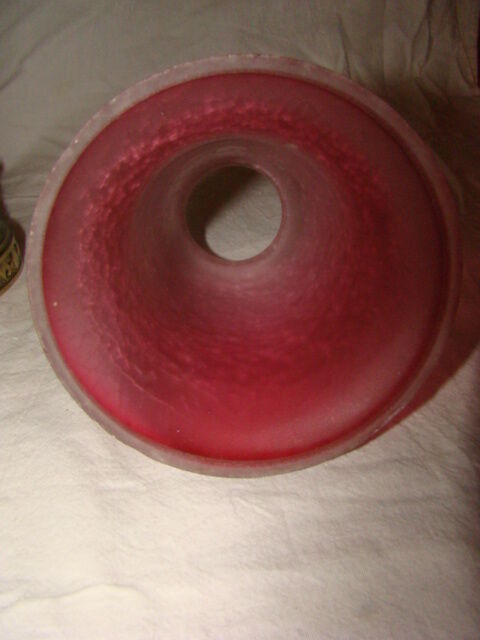 bronze bedside lamp with a pink cracked glass shade