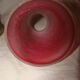 bronze bedside lamp with a pink cracked glass shade