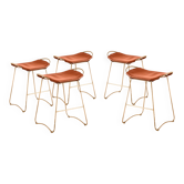 5 contemporary sculptural bar stools in metal, brass, and tobacco leather.