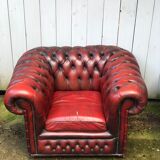 Pair of red leather chesterfield chairs