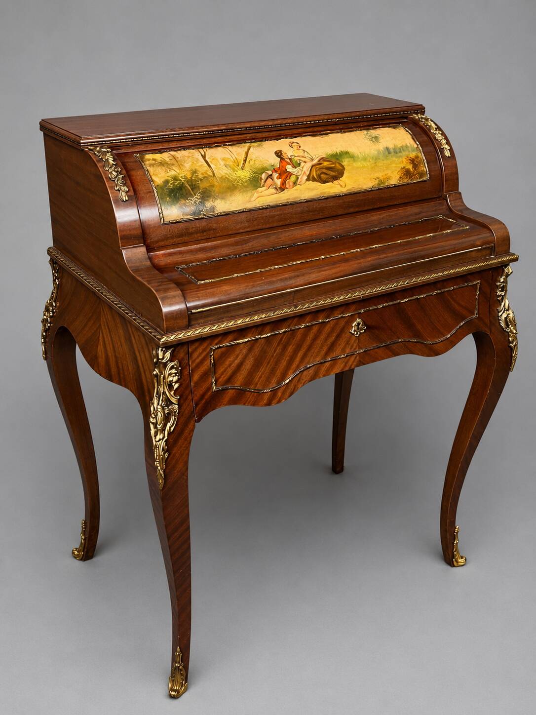 Louis XV style cylinder desk with gilded bronze mounts.