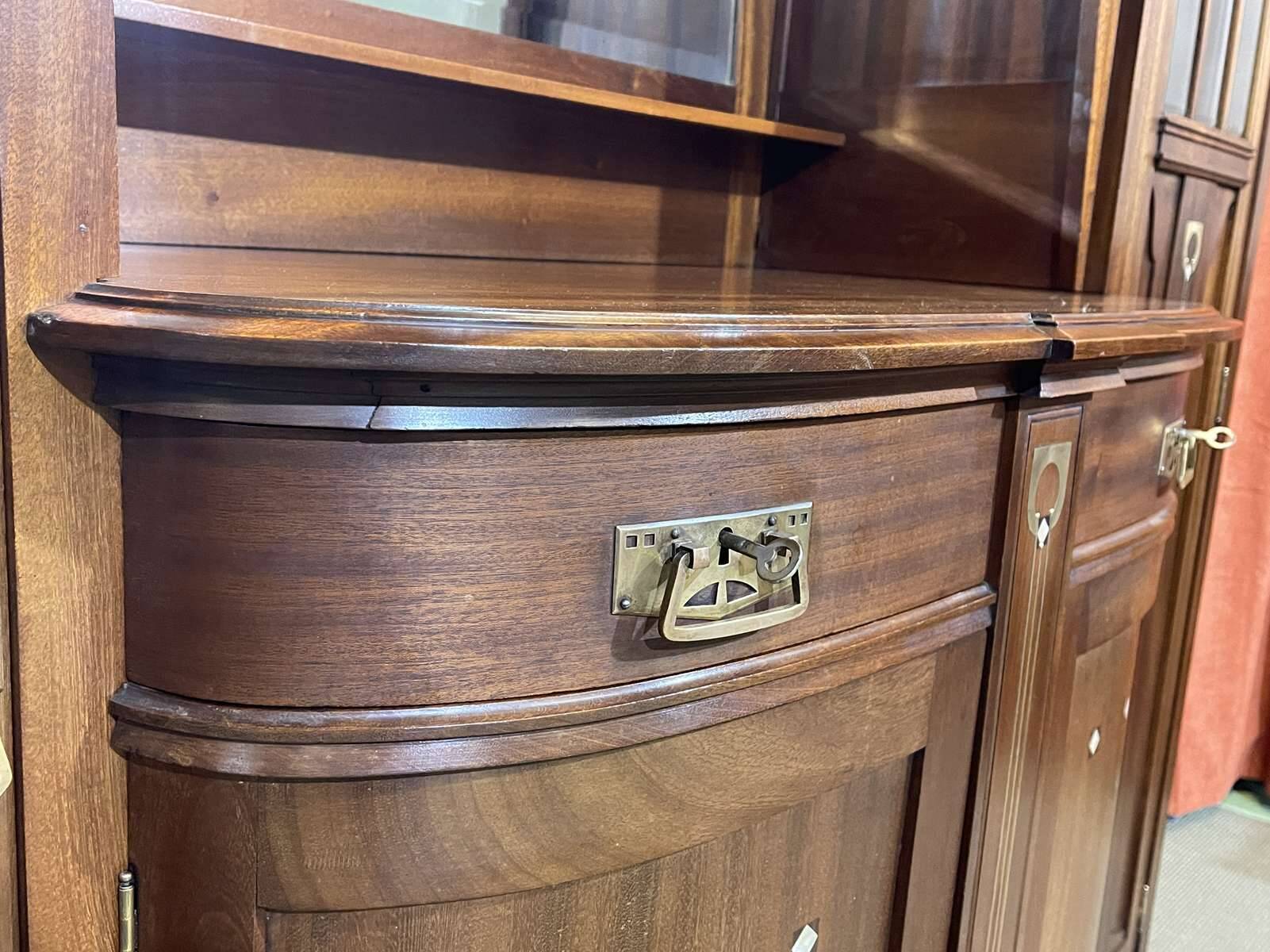 Art Nouveau mahogany buffet with clock in the style of G. Serrurier Bovy.