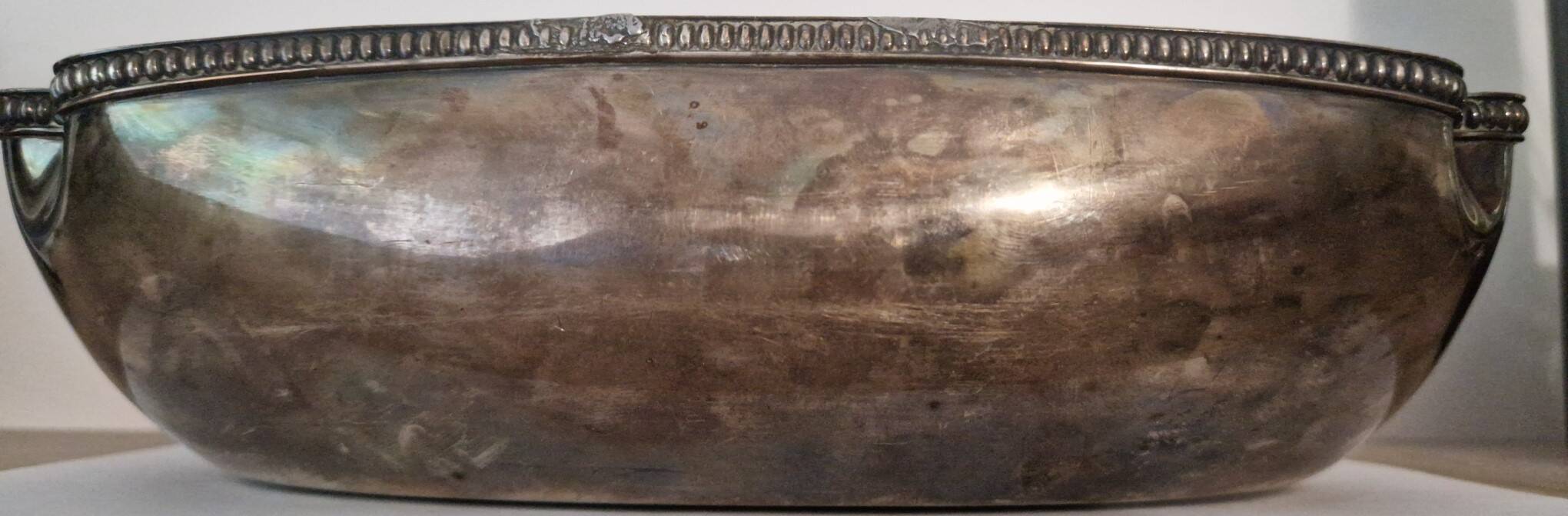 I037 Large shallow antique silver-plated dish in the Louis XVI style with bead decoration.