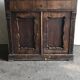 Vintage brown pine dresser with a painted top, moulded panels, and decorative locks.