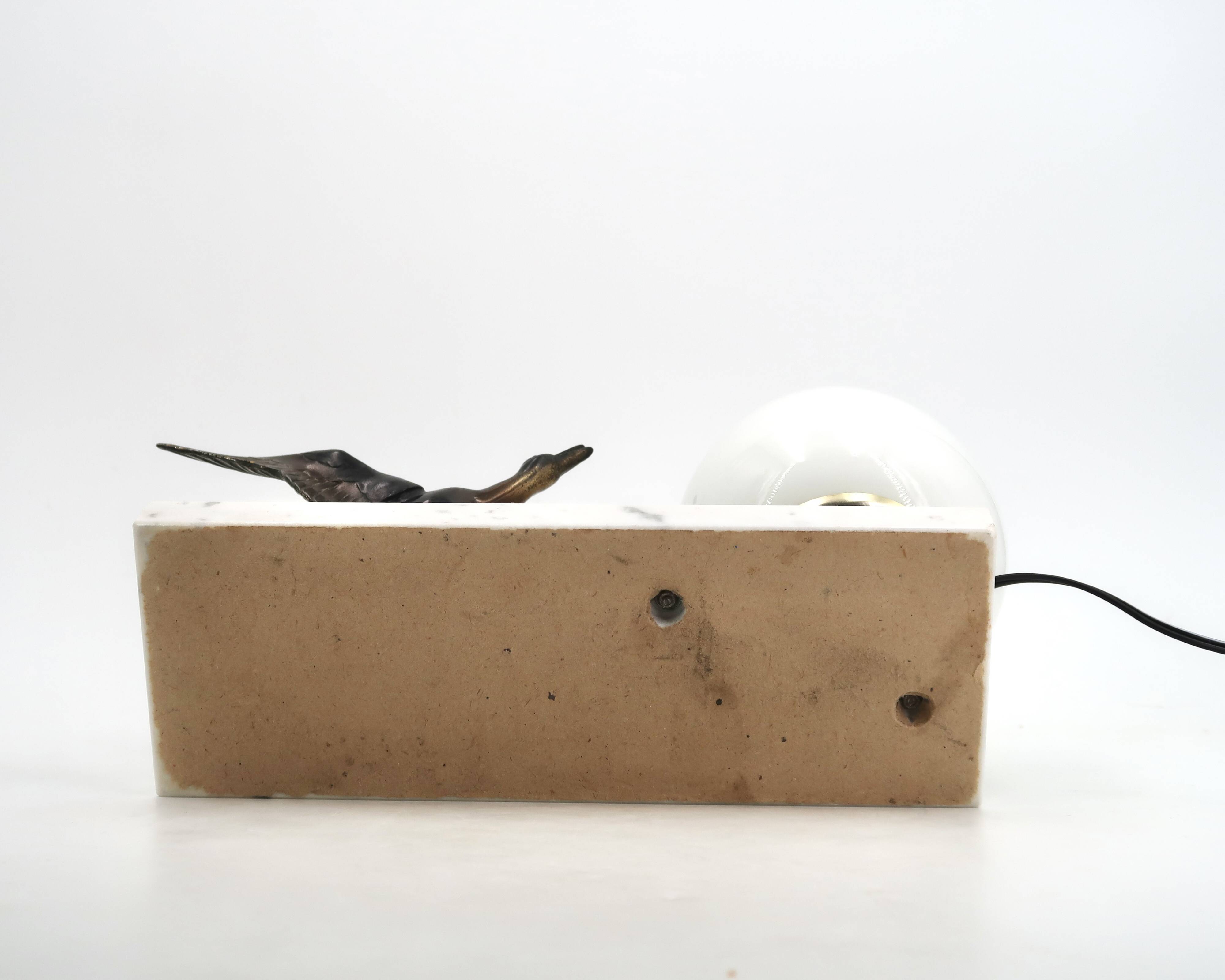 Art Deco lamp decorated with a flying duck, marble base, 1930s.
