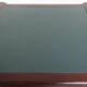 Partner desk in English style with dark wood and a green leather top