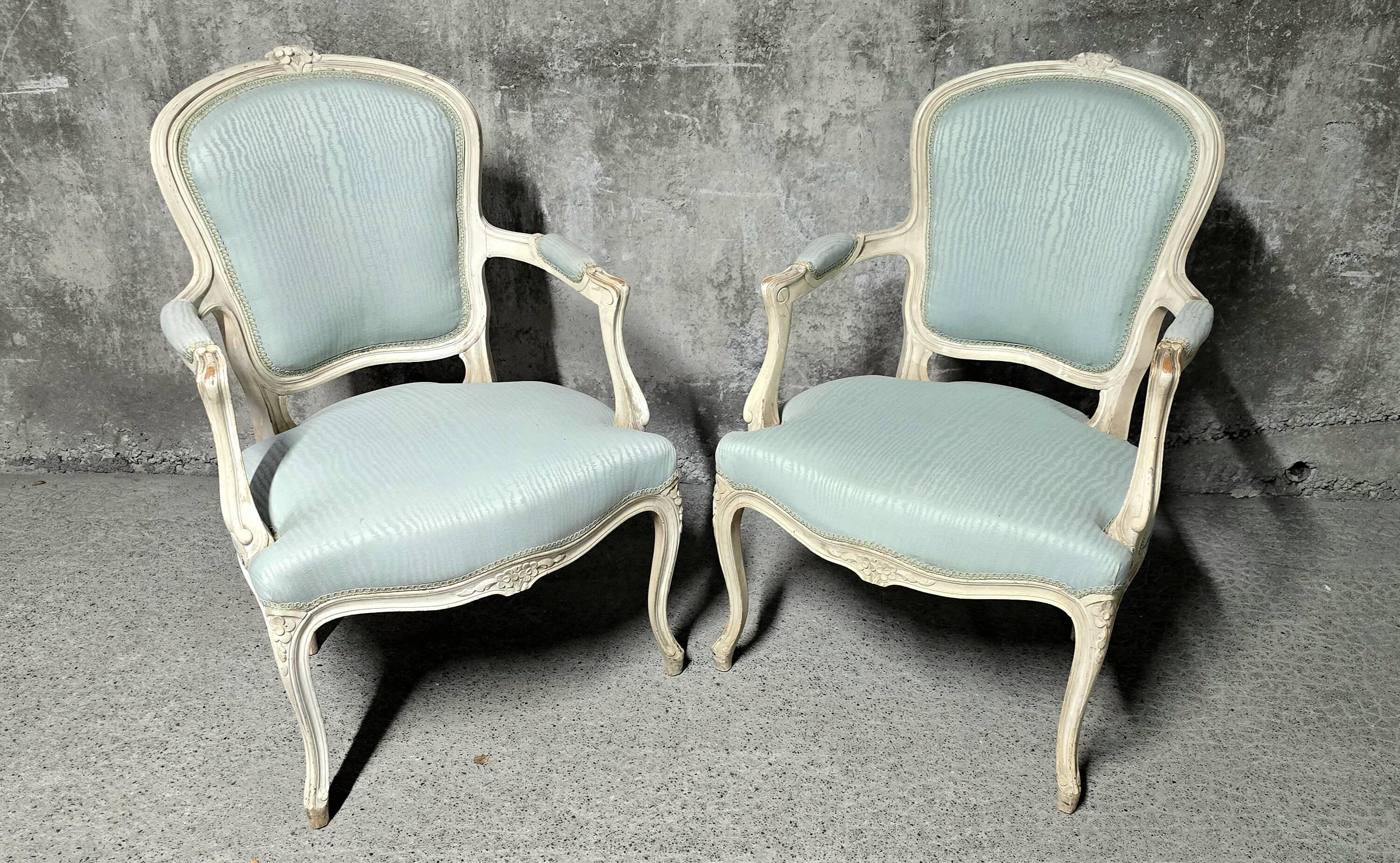 Pair of Louis XV style armchairs in patinated wood, light blue fabric.