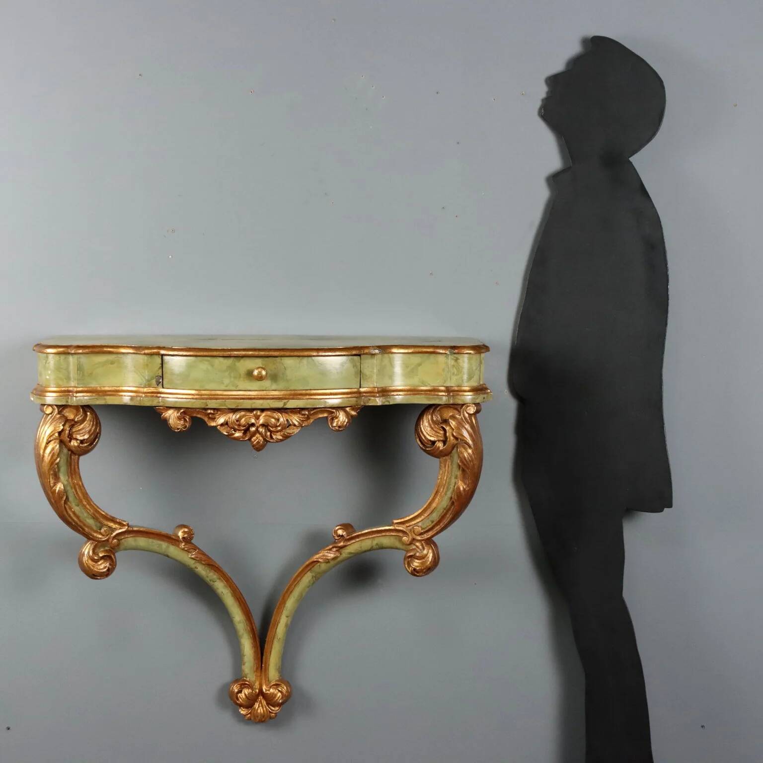 19th-century carved wooden drop-leaf console.