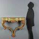 19th-century carved wooden drop-leaf console.
